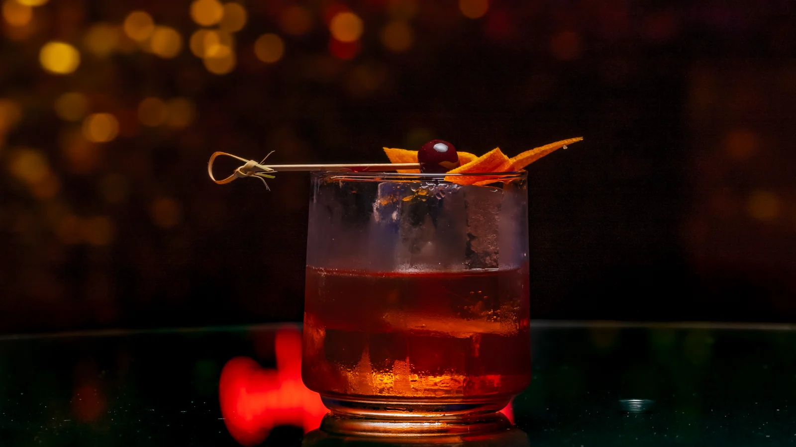 A cocktail photographed in warm restaurant lighting.