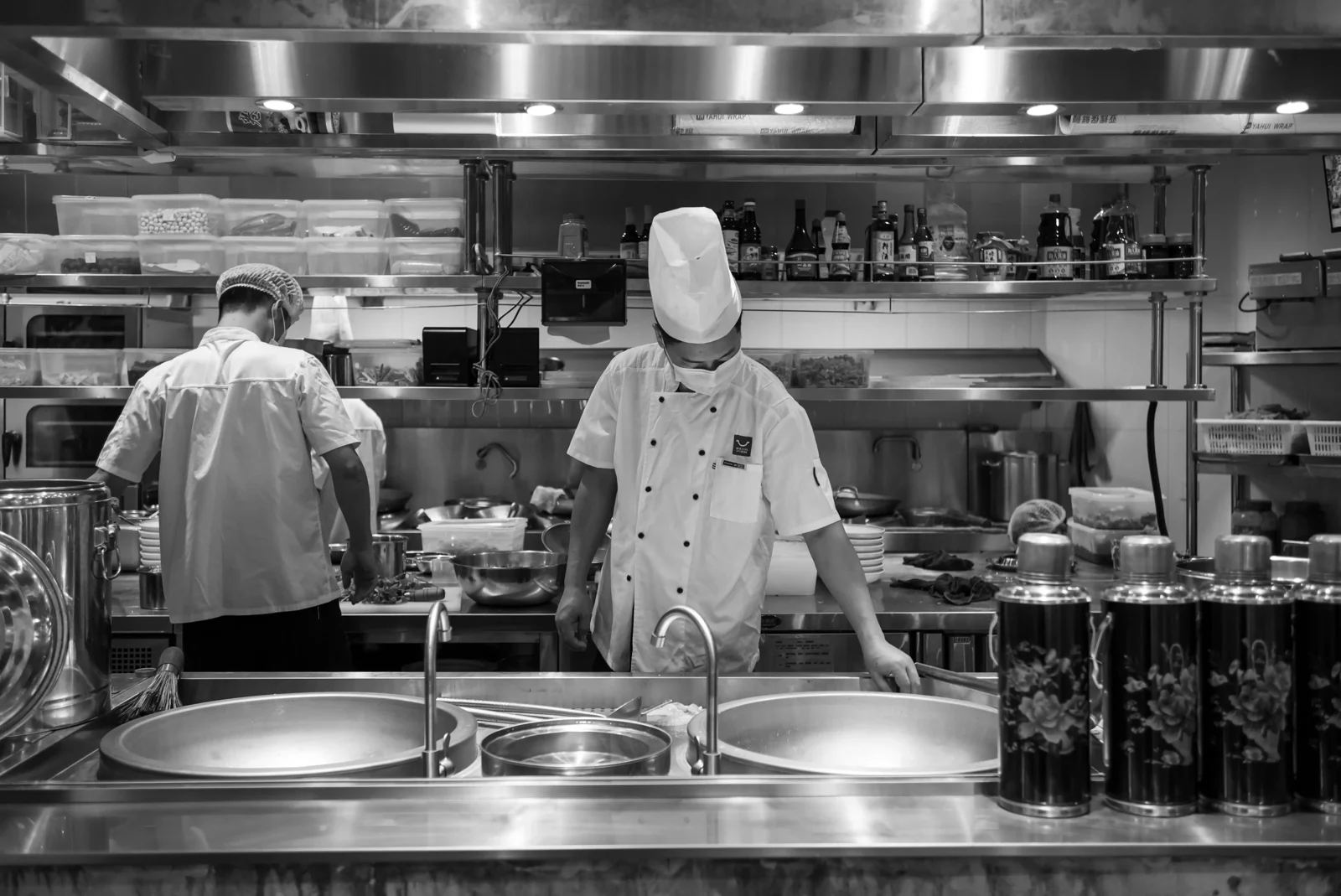Chefs working in a restaurant kitchen.