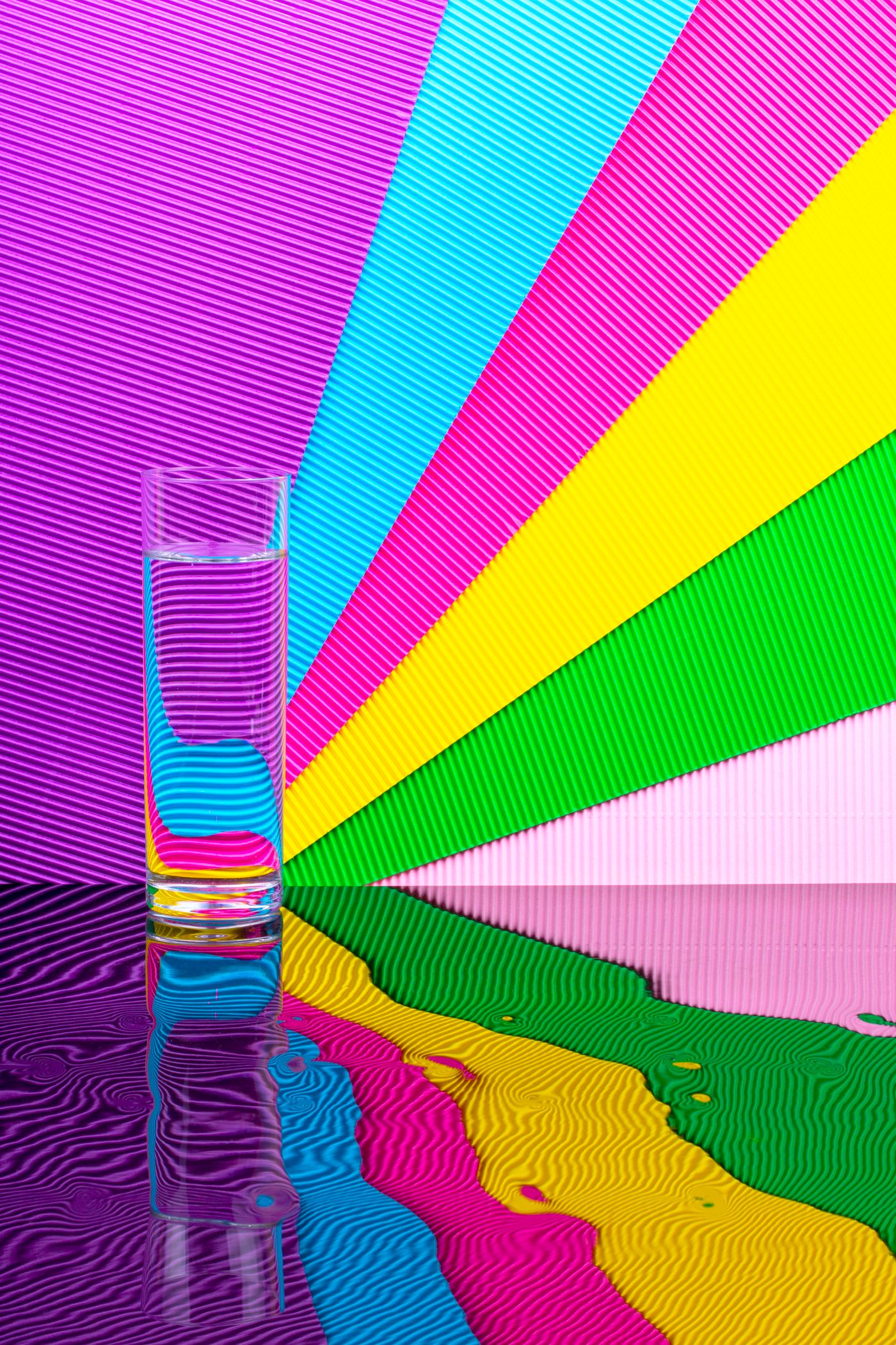 Color and light refracted through a glass of water.